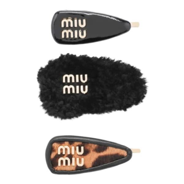 Set of black leather/cowhide/shearling clips