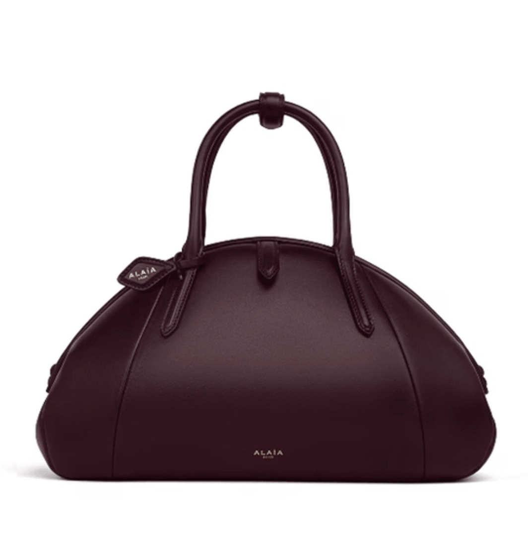 ALAÏA Bordeaux PURSE TOP HANDLE BAG IN CALFSKIN