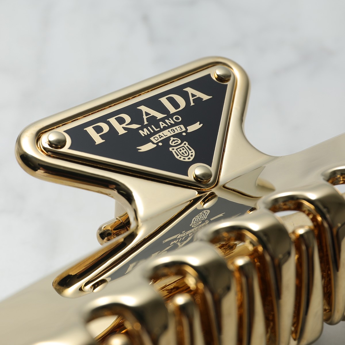 Prada Triangle logo hair clip