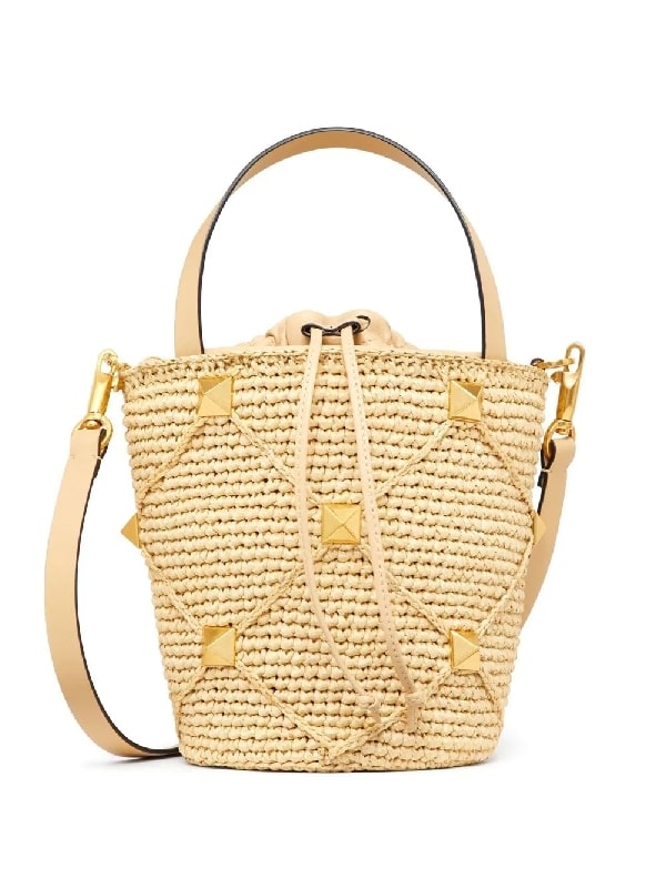 Roman studded raffia bucket bag