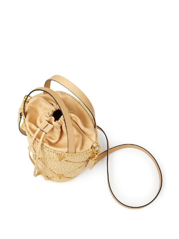 Roman studded raffia bucket bag